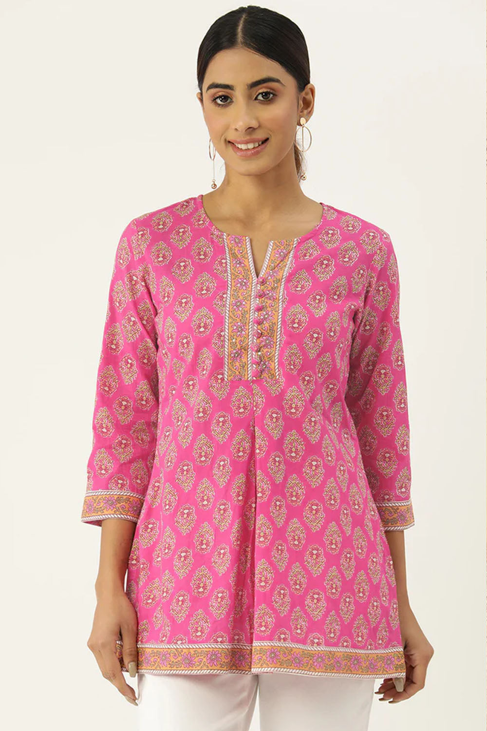 Pink cotton court with traditional Indian ornaments