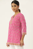 Pink cotton court with traditional Indian ornaments