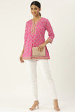 Pink cotton court with traditional Indian ornaments