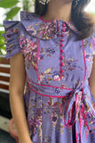 Elegant purple maxi dress with decorative sleeves and belt