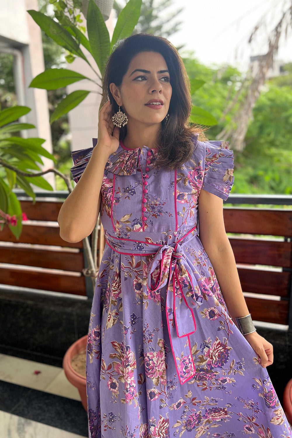 Elegant purple maxi dress with decorative sleeves and belt